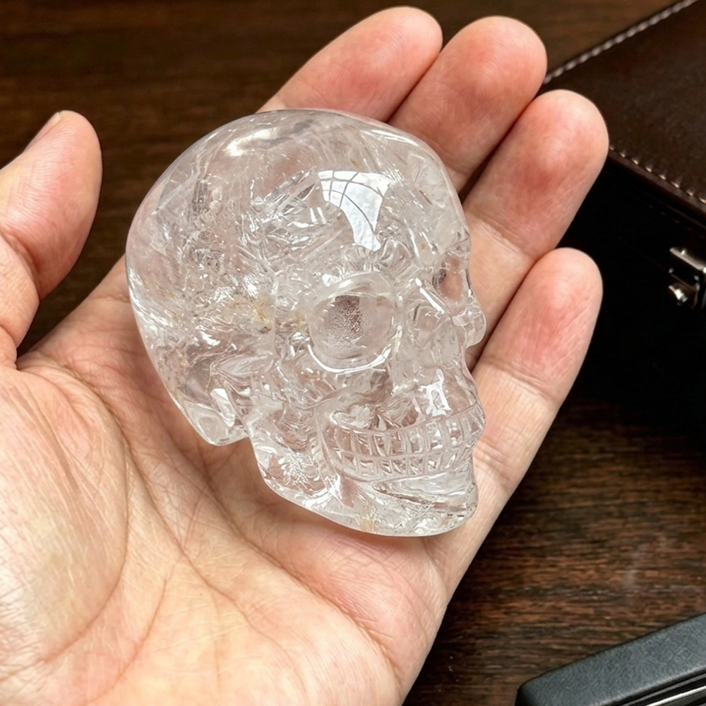 Additional view of a 2-inch Clear Quartz human skull carving
