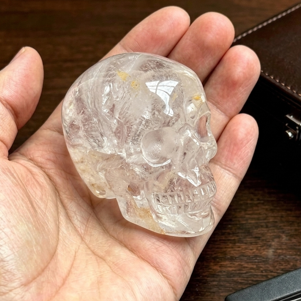 Additional view of a 2-inch Clear Quartz human skull carving