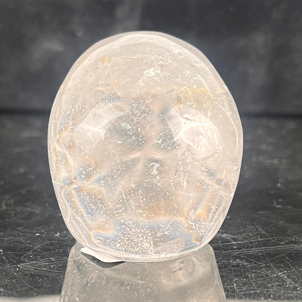 Back view of a 2-inch Clear Quartz human skull carving