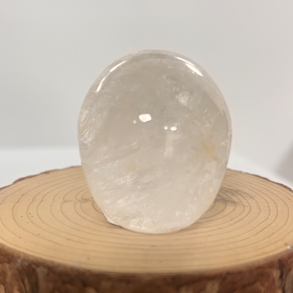 Back view of a 2-inch Clear Quartz human skull carving
