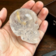 Main view of a 2-inch Clear Quartz human skull carving