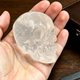 Main view of a 2-inch Clear Quartz human skull carving
