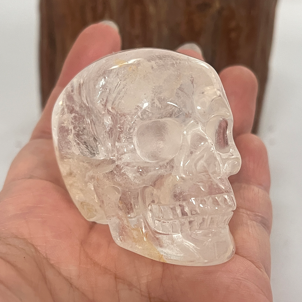 Main view of a 2-inch Clear Quartz human skull carving