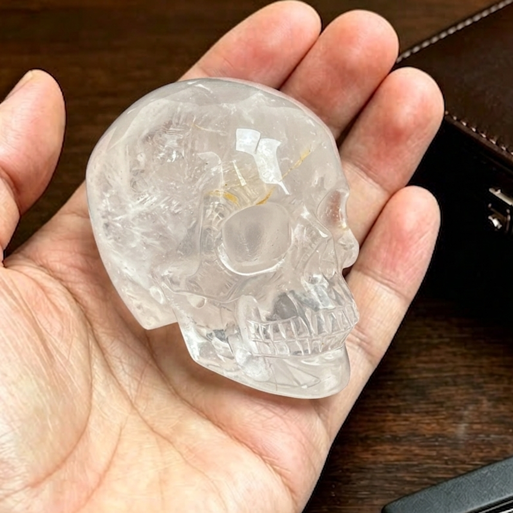 Main view of a 2-inch Clear Quartz human skull carving