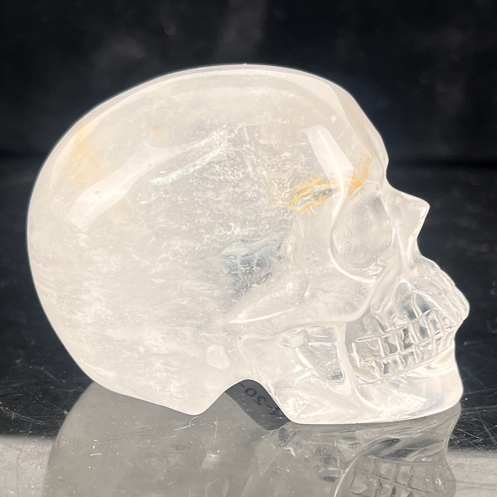 Right view of a 2-inch Clear Quartz human skull carving
