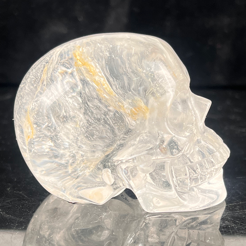 Right view of a 2-inch Clear Quartz human skull carving