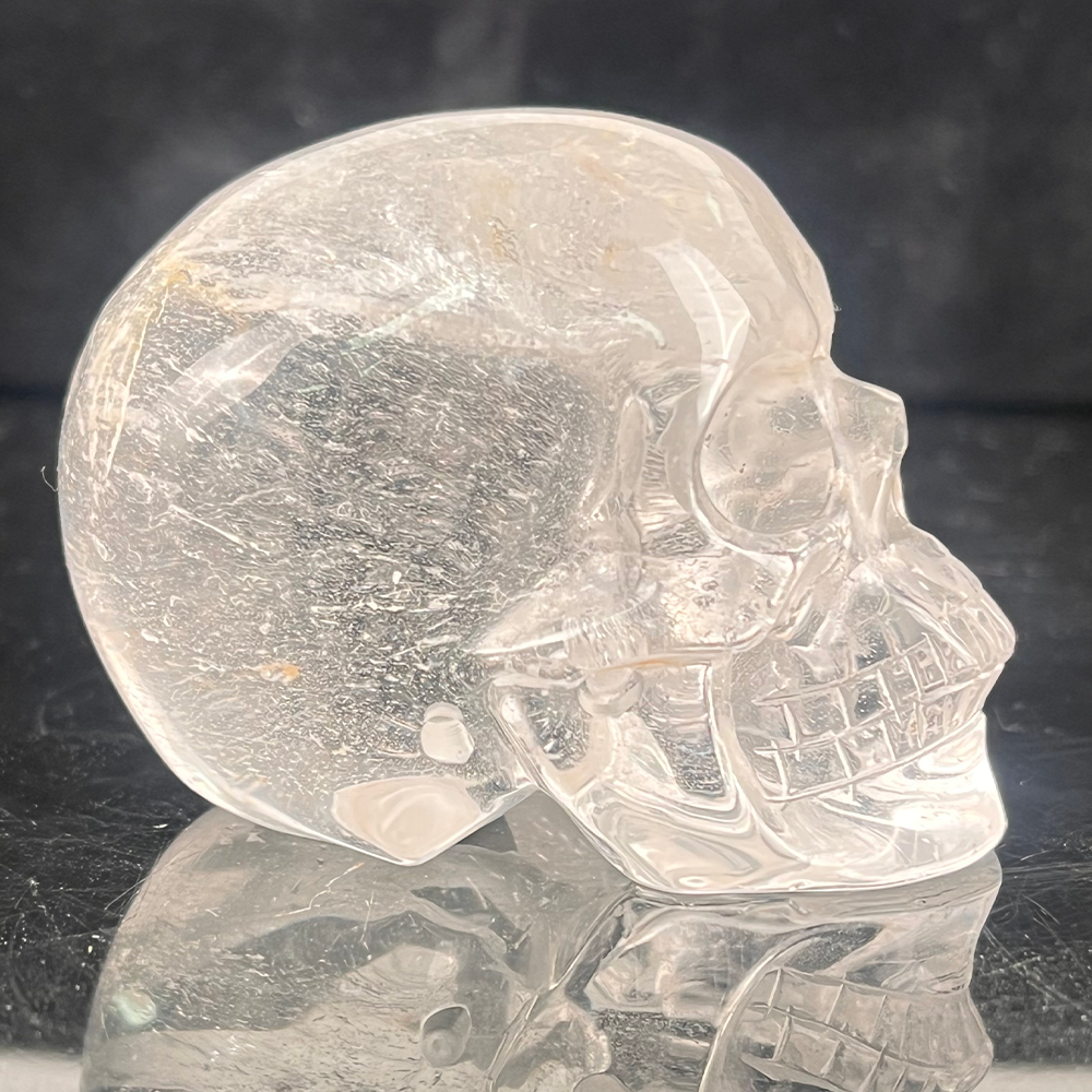Right view of a 2-inch Clear Quartz human skull carving