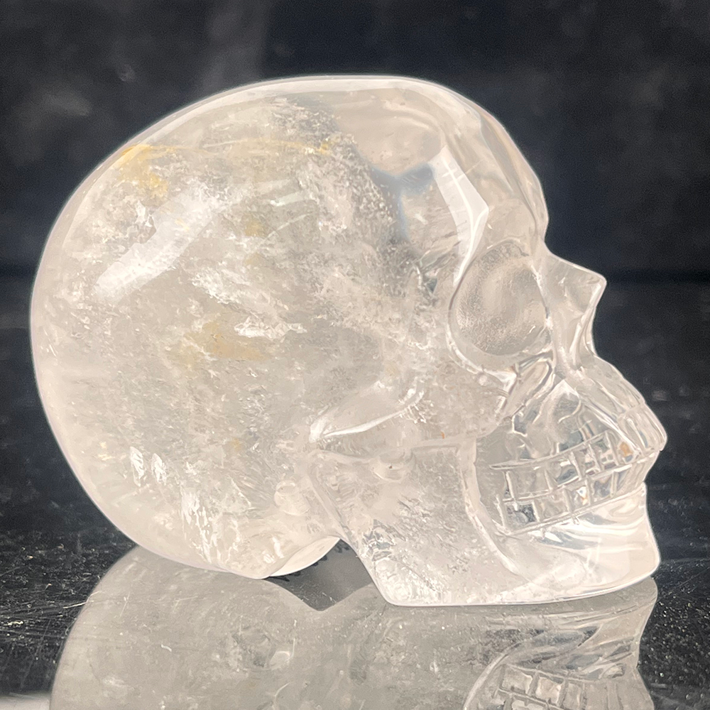 Right view of a 2-inch Clear Quartz human skull carving