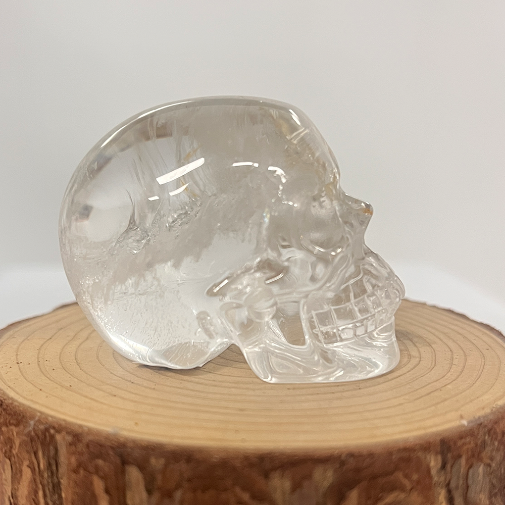 Right view of a 2-inch Clear Quartz human skull carving