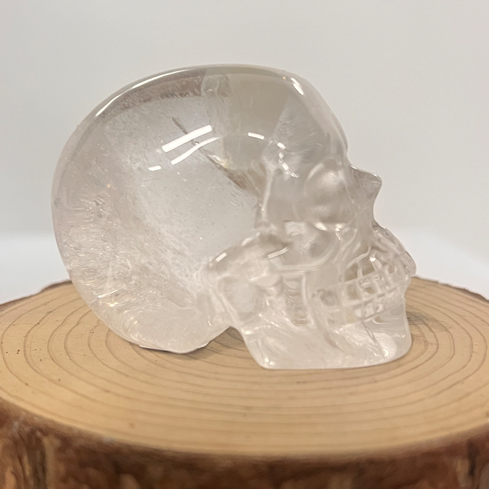 Right view of a 2-inch Clear Quartz human skull carving