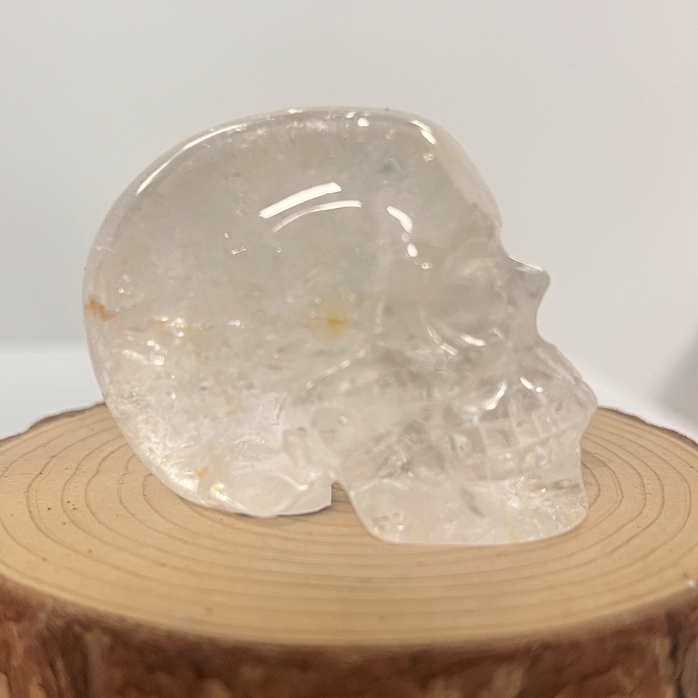Right view of a 2-inch Clear Quartz human skull carving