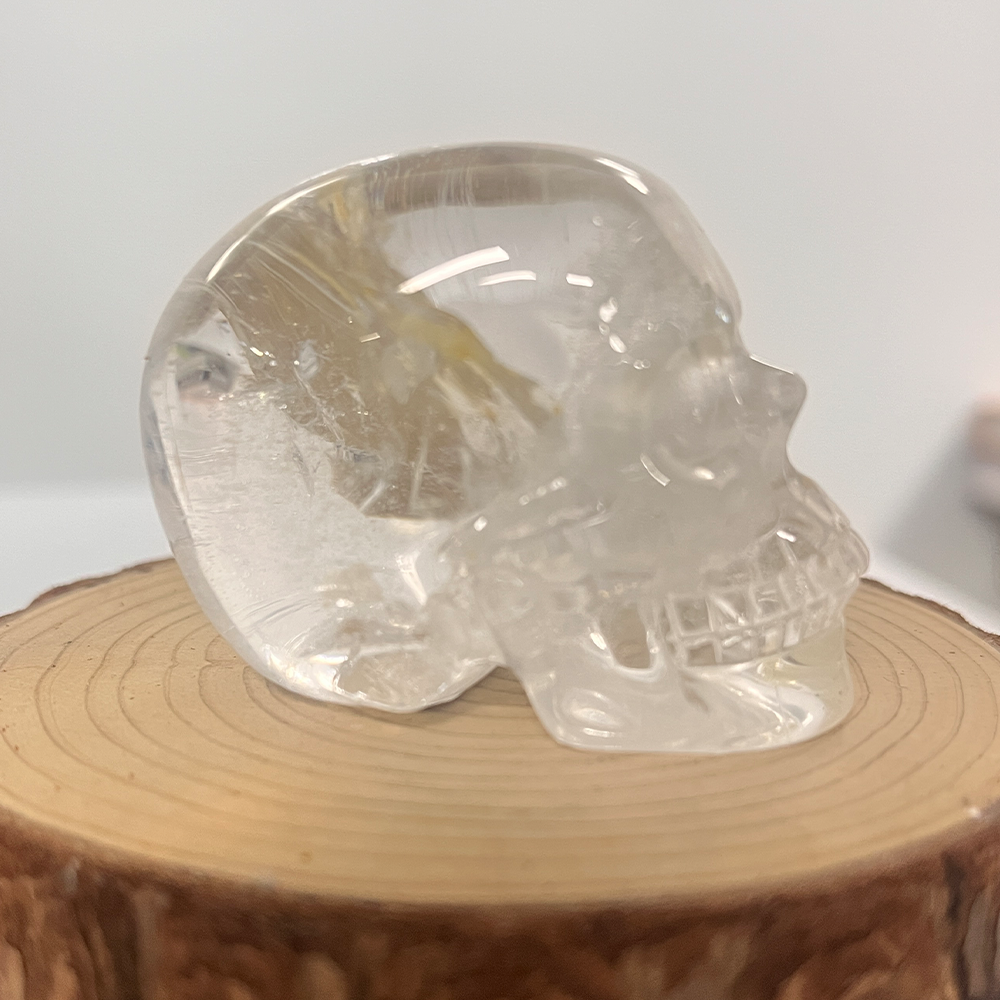 Right view of a 2-inch Clear Quartz human skull carving