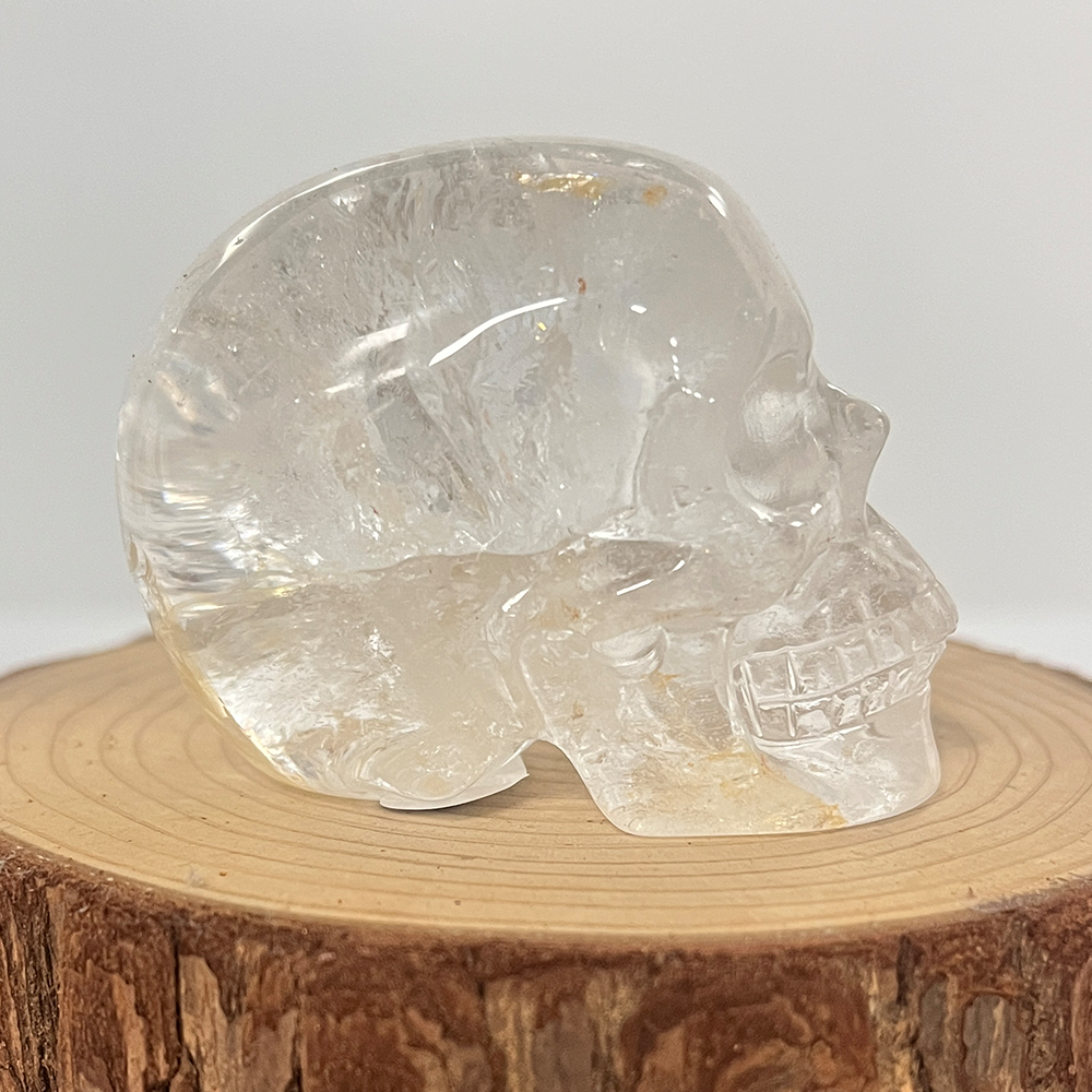 Right view of a 2-inch Clear Quartz human skull carving