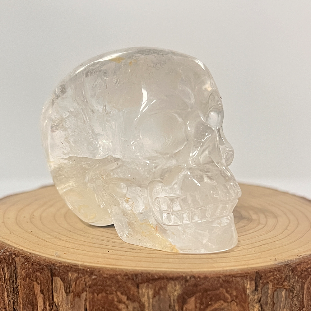 Right-front view of a 2-inch Clear Quartz human skull carving