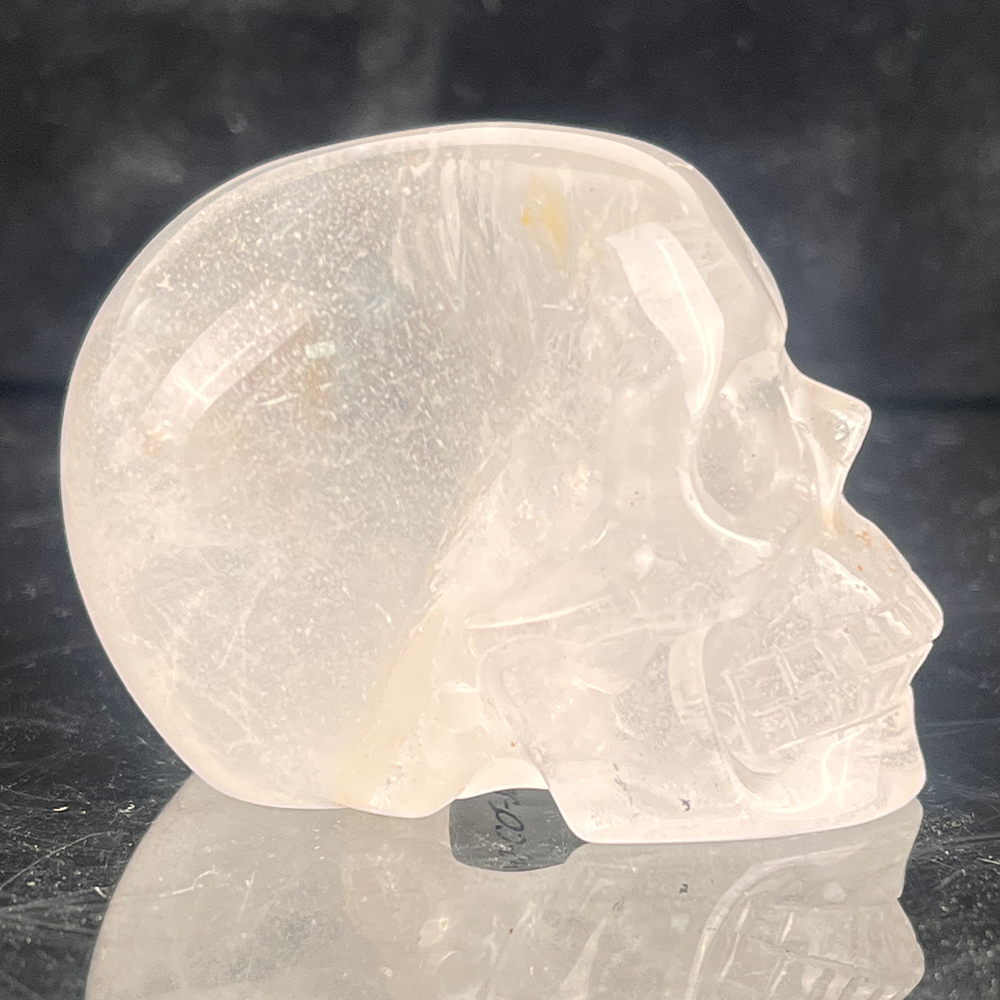 Right view of a 2-inch Clear Quartz human skull carving