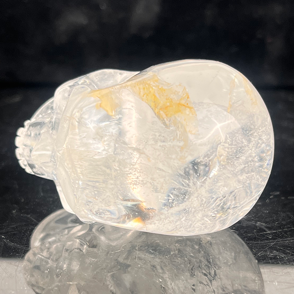 Top view of a 2-inch Clear Quartz human skull carving