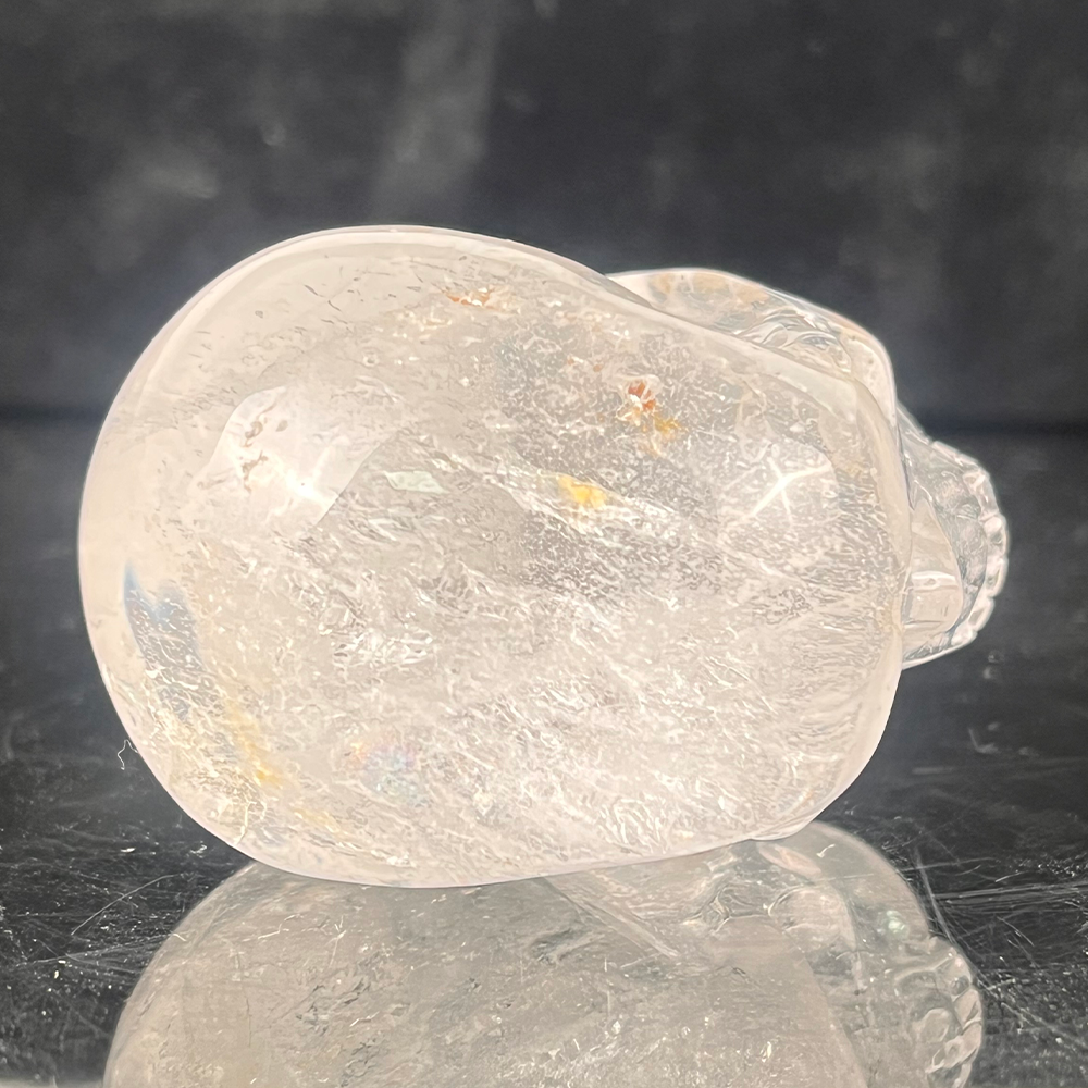 Top view of a 2-inch Clear Quartz human skull carving