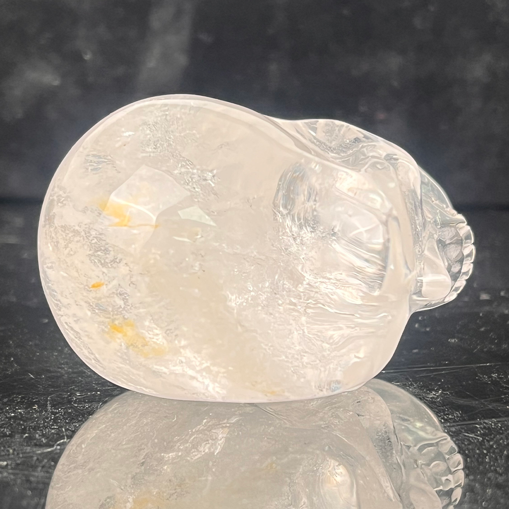 Top view of a 2-inch Clear Quartz human skull carving