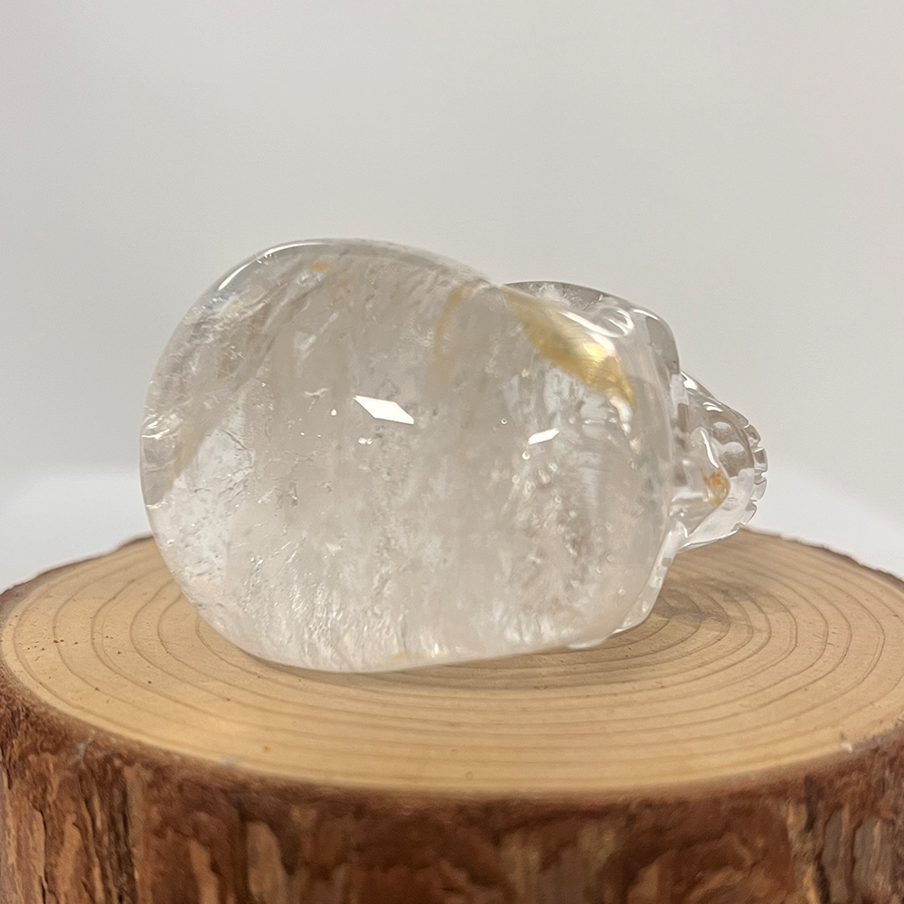 Top view of a 2-inch Clear Quartz human skull carving