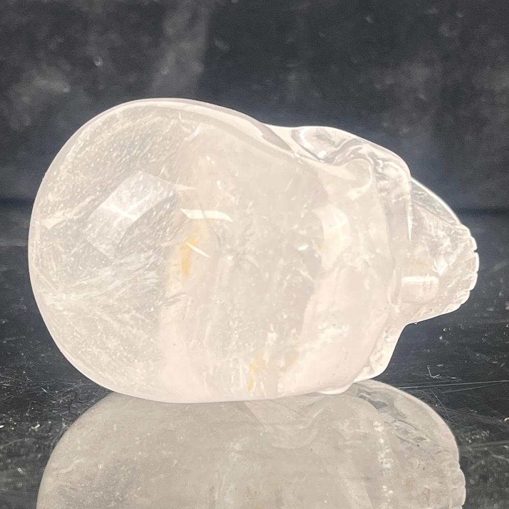 Top view of a 2-inch Clear Quartz human skull carving