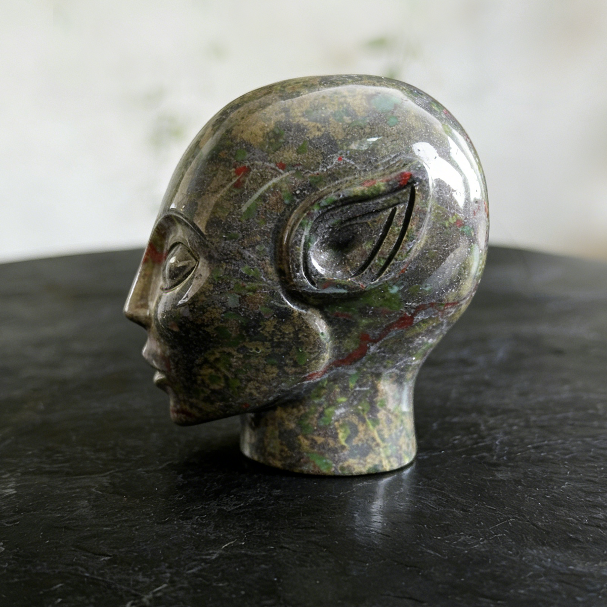 Additional view of a 3-inch Dragon Bloodstone alien skull carving