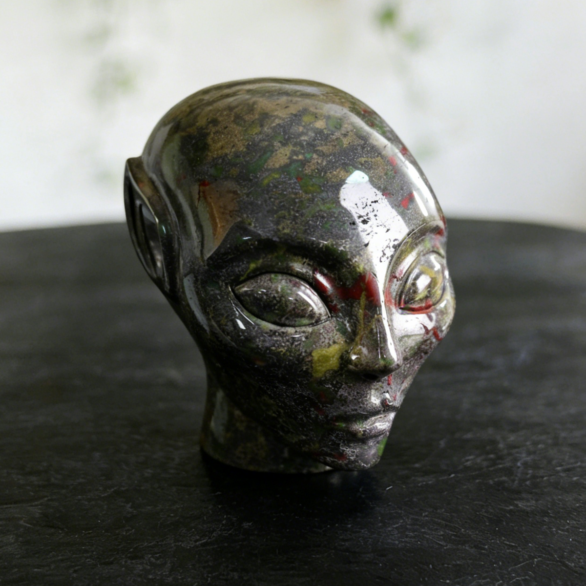 Additional view of a Dragon Bloodstone alien skull carving