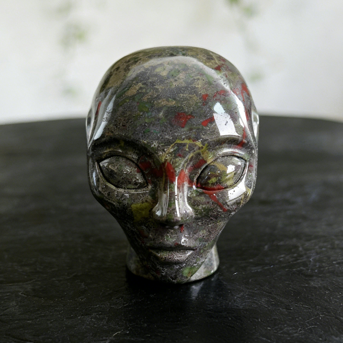 Additional view of a Dragon Bloodstone alien skull carving