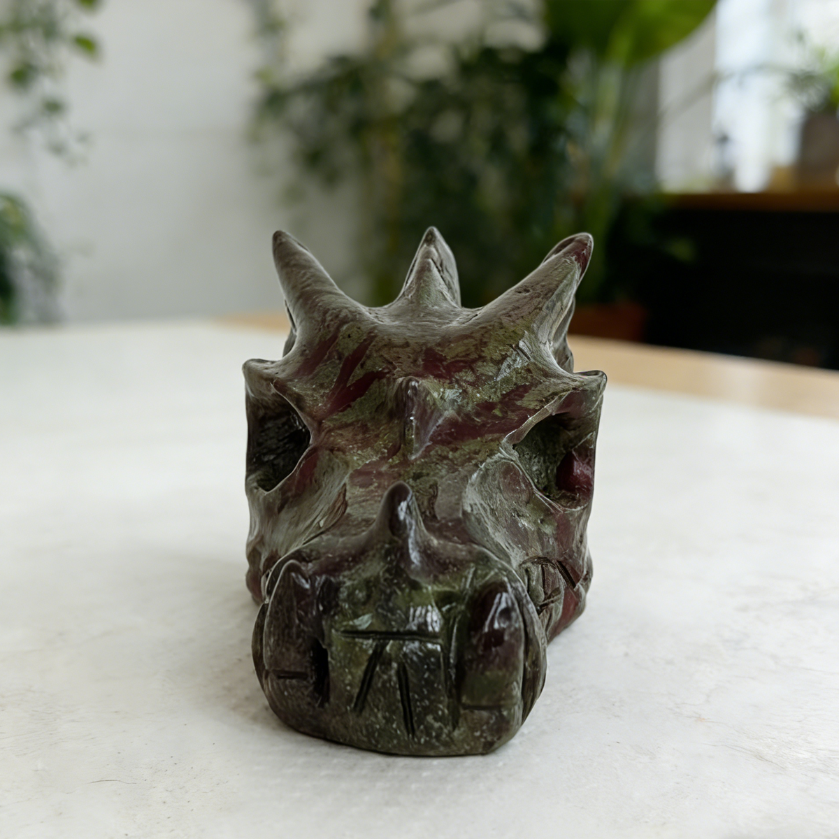 Additional view of a 2-inch Dragon Bloodstone dragon skull carving