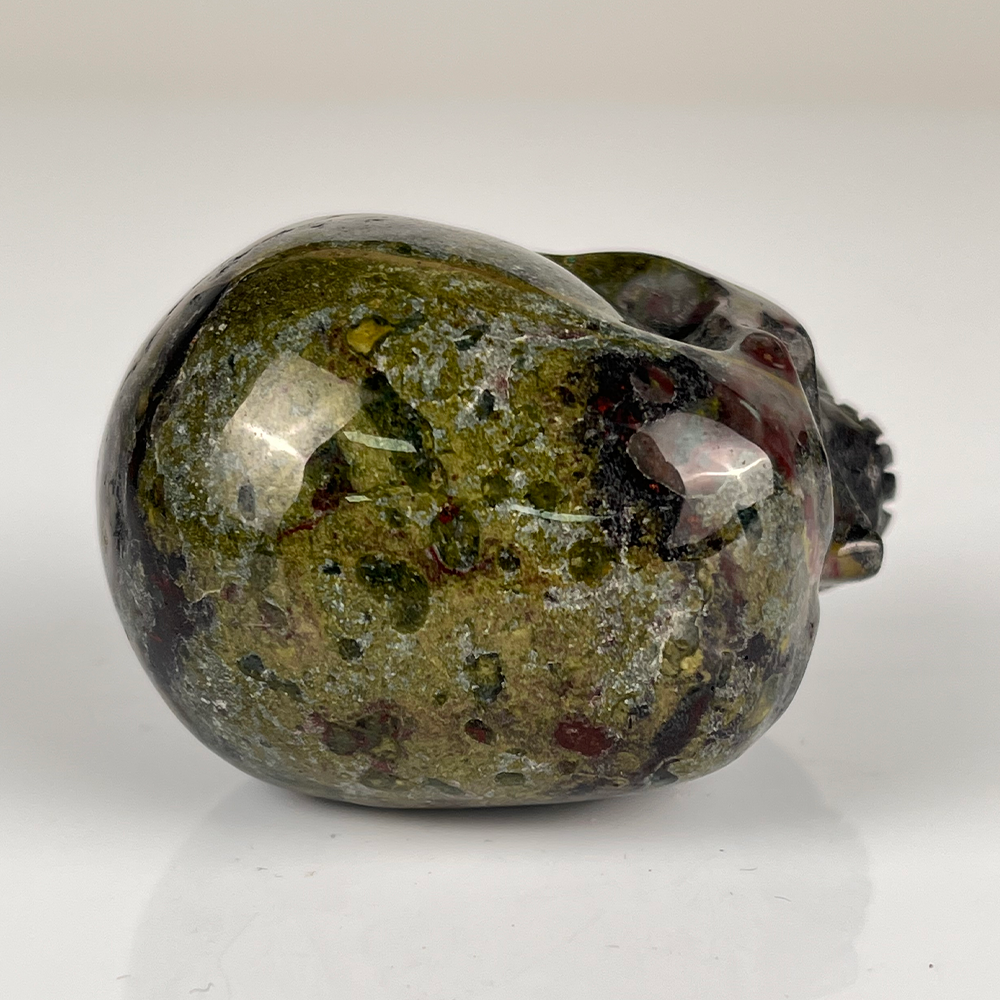 Top view of a 2-inch Dragon Bloodstone human skull carving