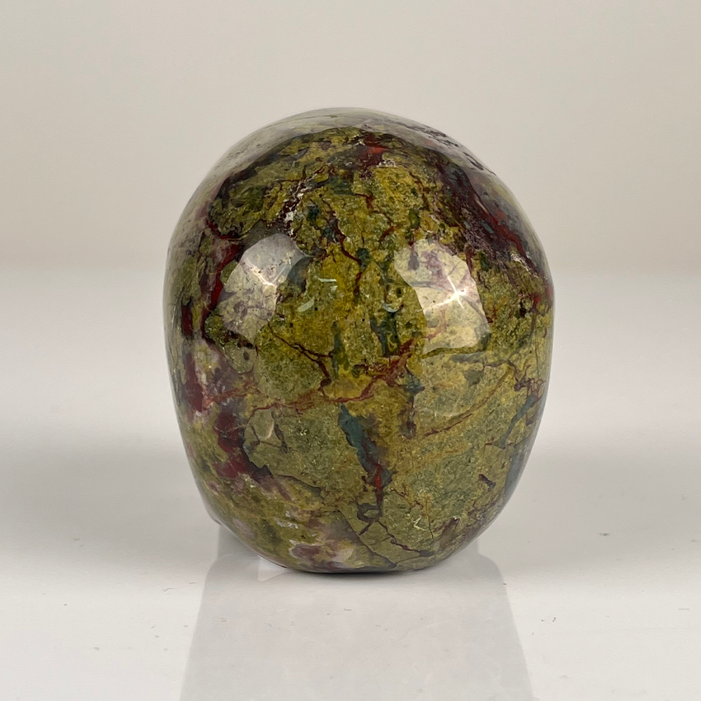 Back view of a 3-inch Dragon Bloodstone human skull carving