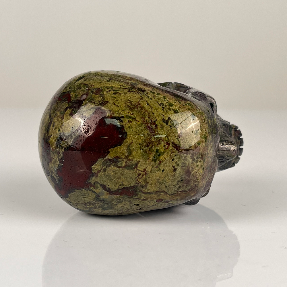 Top view of a 3-inch Dragon Bloodstone human skull carving
