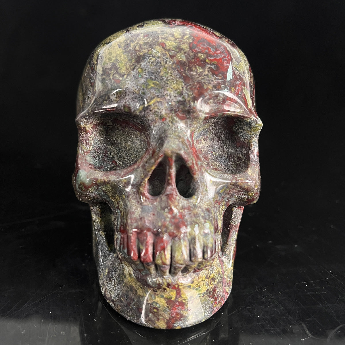 Front view of a 4.5-inch Dragon Bloodstone human skull carving