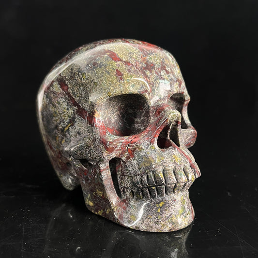 Right-front view of a 4.5-inch Dragon Bloodstone human skull carving