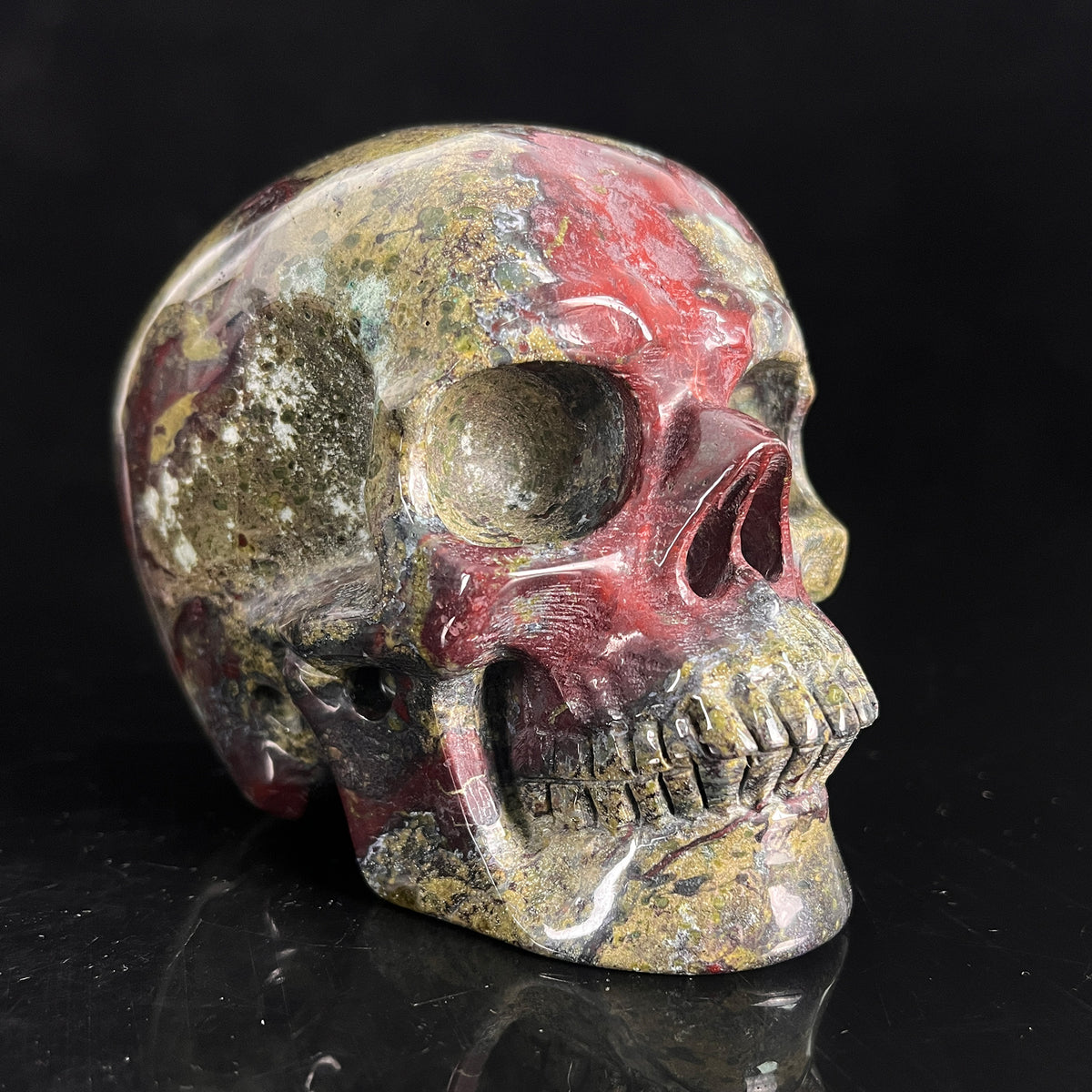 Right-front view of a 4.5-inch Dragon Bloodstone human skull carving