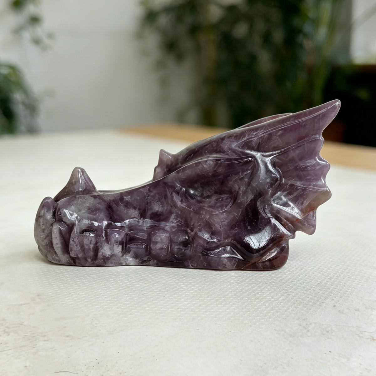Additional view of a 3-inch Dream Amethyst dragon skull carving