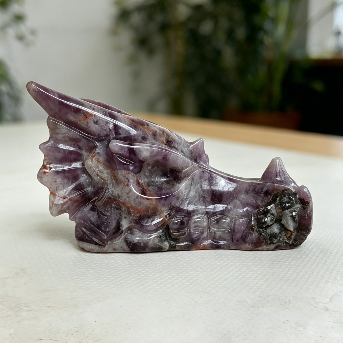 Additional view of a 3-inch Dream Amethyst dragon skull carving