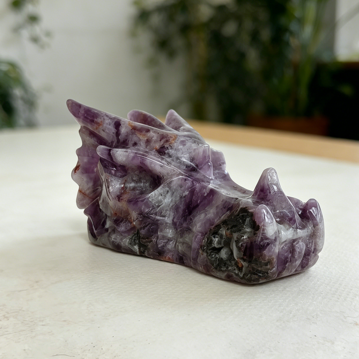 Additional view of a 3-inch Dream Amethyst dragon skull carving