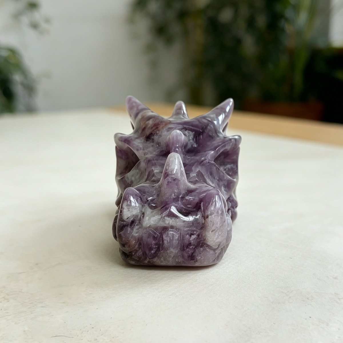 Additional view of a 3-inch Dream Amethyst dragon skull carving