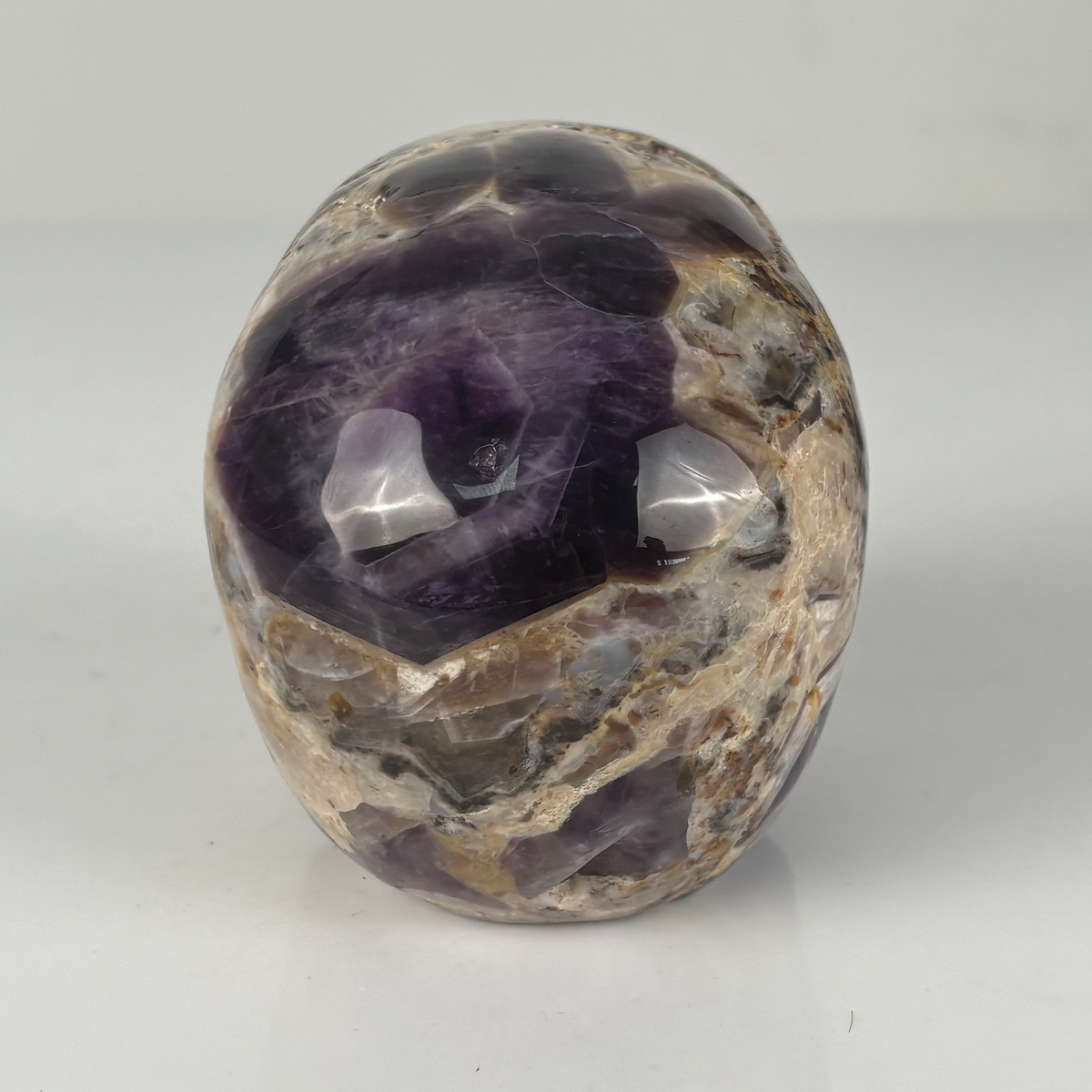 Back view of a 4.5-inch Dream Amethyst human skull carving