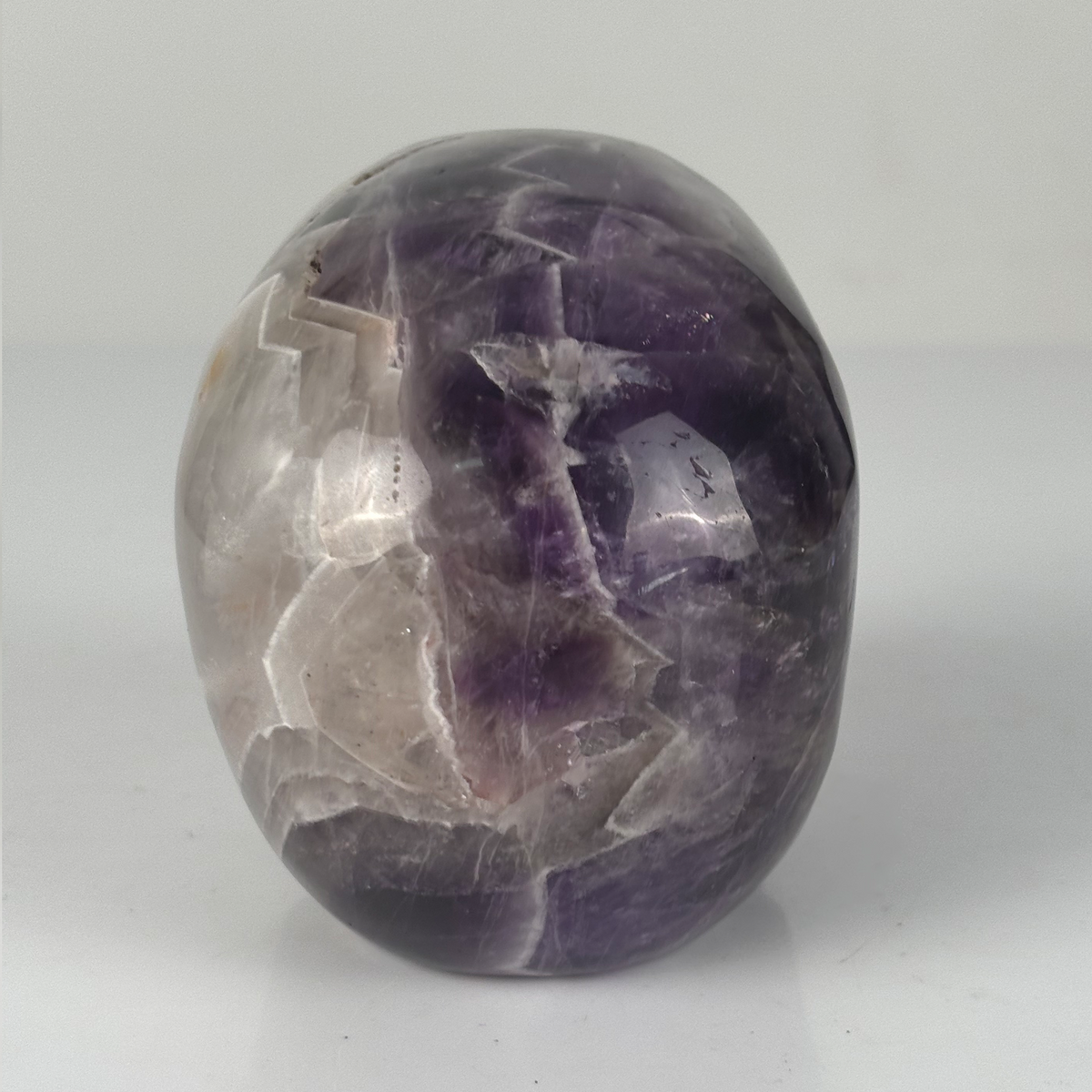 Back view of a 4.5-inch Dream Amethyst human skull carving