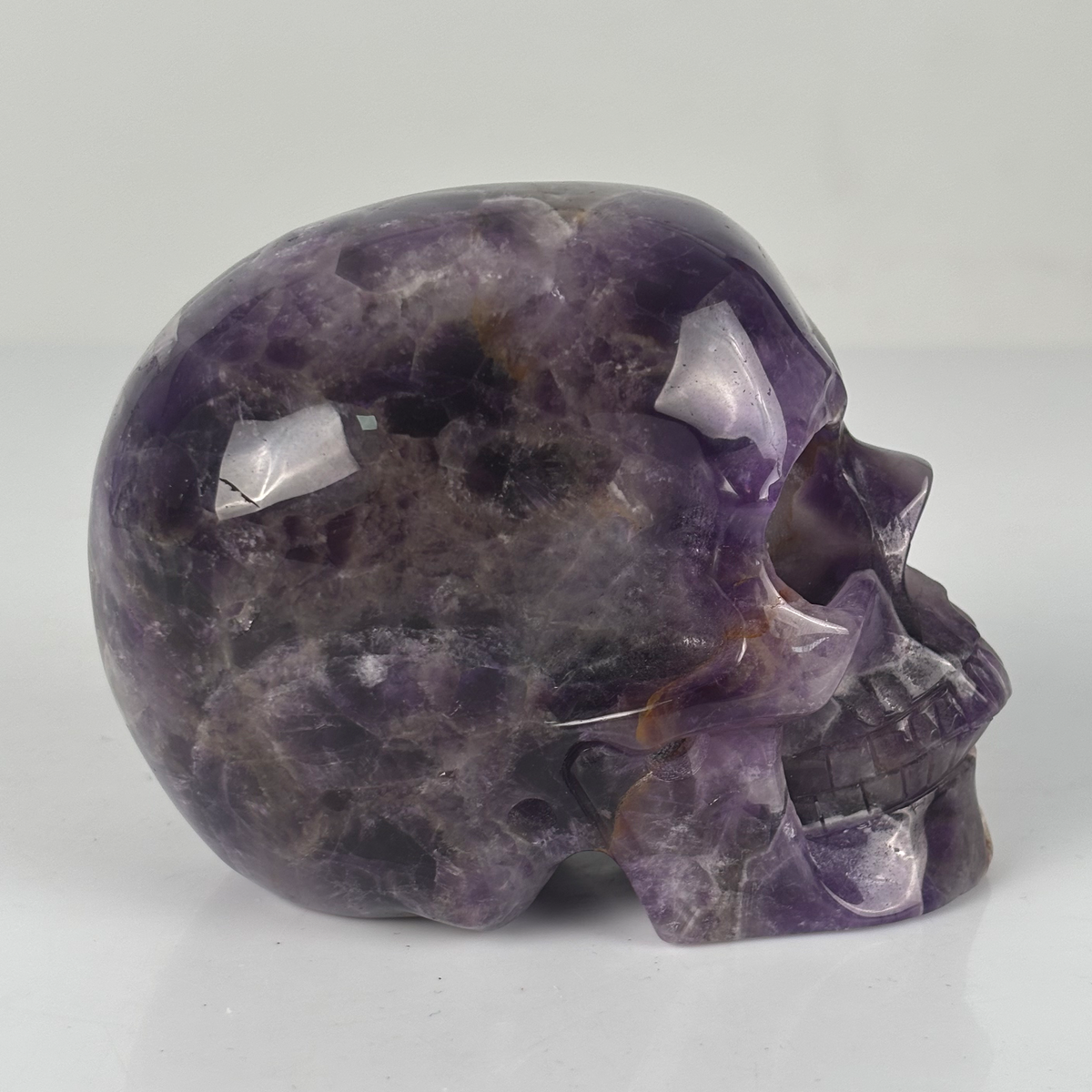 Right view of a 4.5-inch Dream Amethyst human skull carving