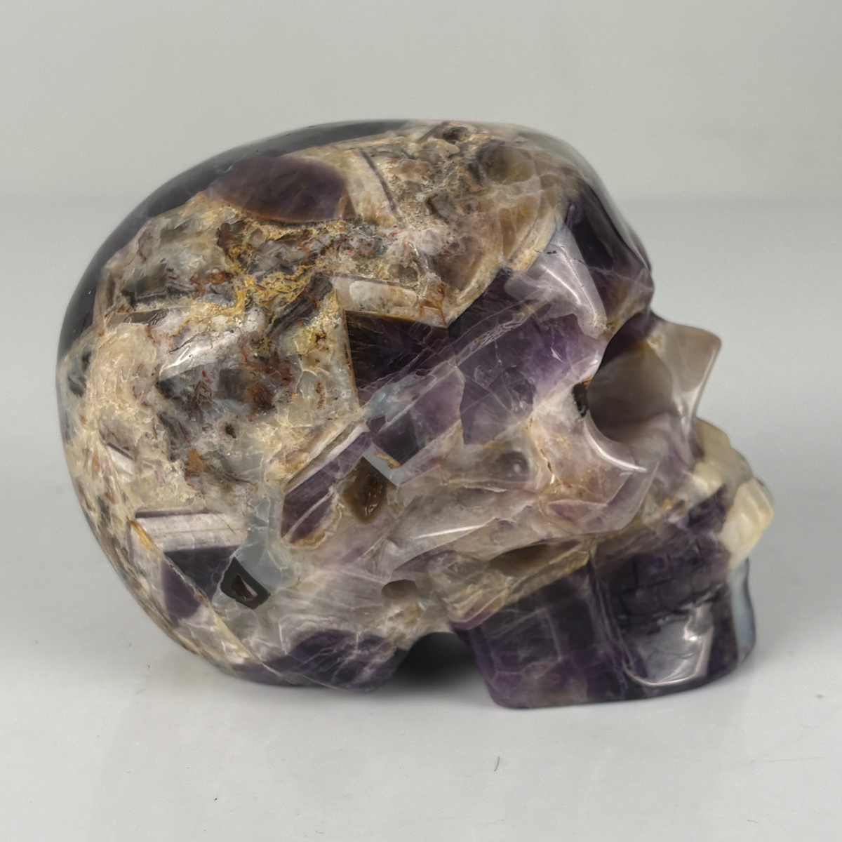 Right view of a 4.5-inch Dream Amethyst human skull carving