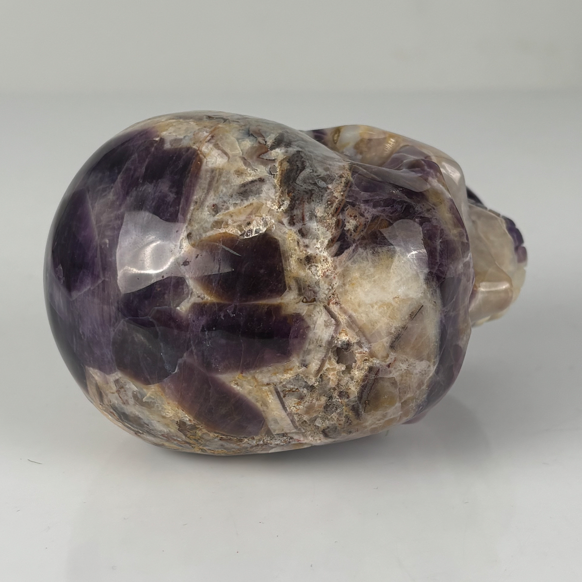 Top view of a 4.5-inch Dream Amethyst human skull carving