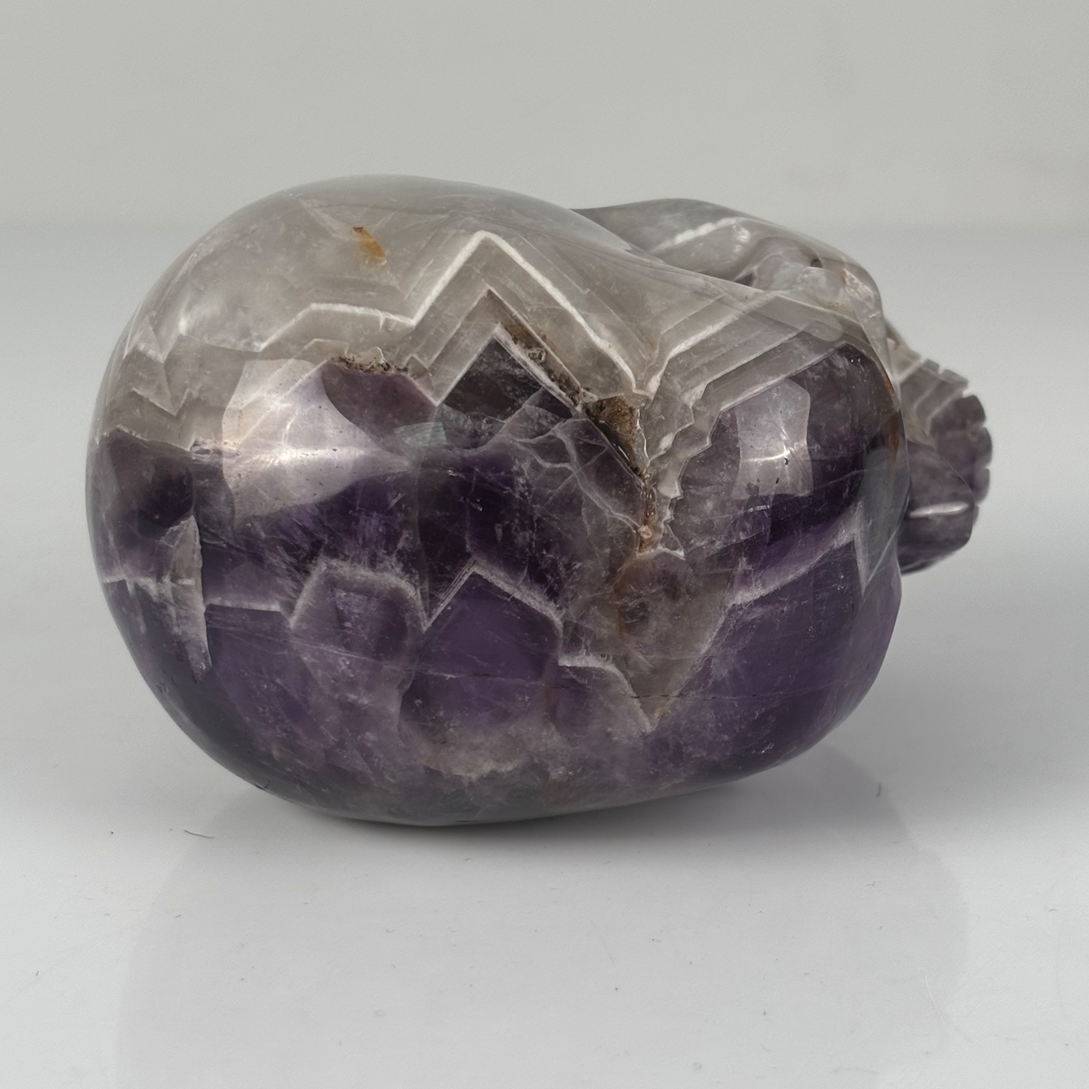 Top view of a 4.5-inch Dream Amethyst human skull carving