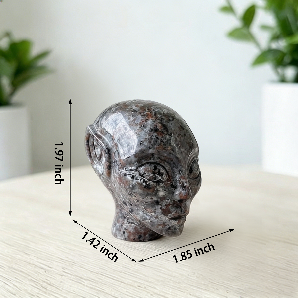 Additional view of a 2-inch Fire Stone alien skull carving