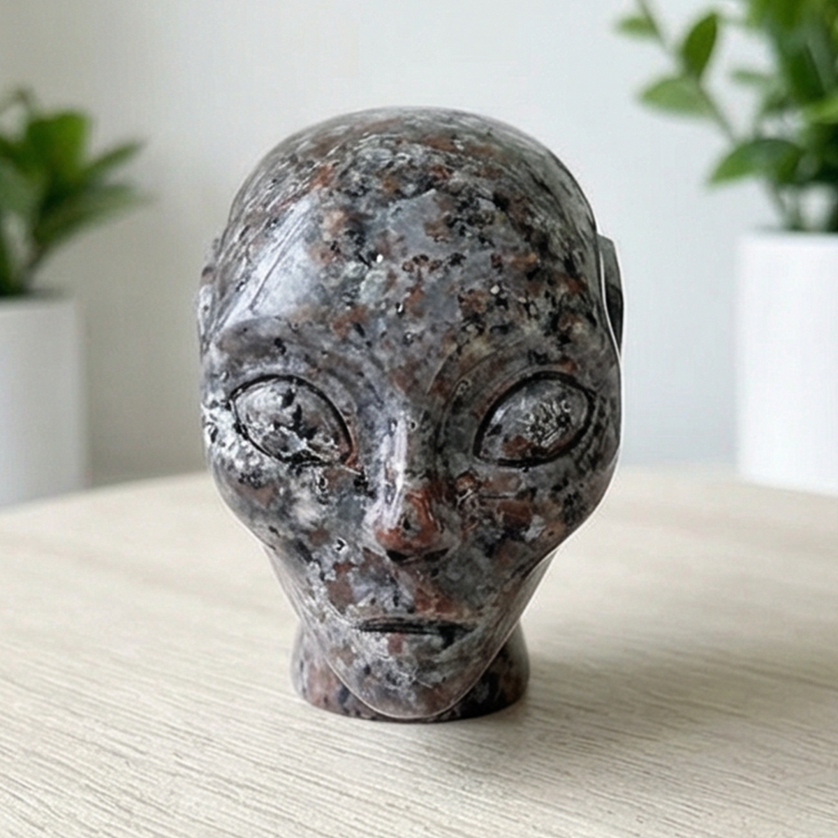 Additional view of a 2-inch Fire Stone alien skull carving