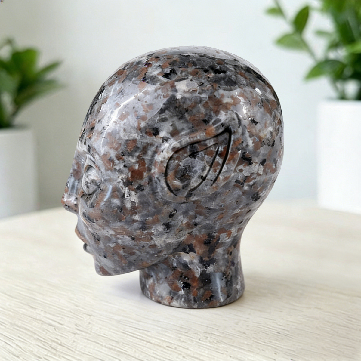 Additional view of a 2-inch Fire Stone alien skull carving