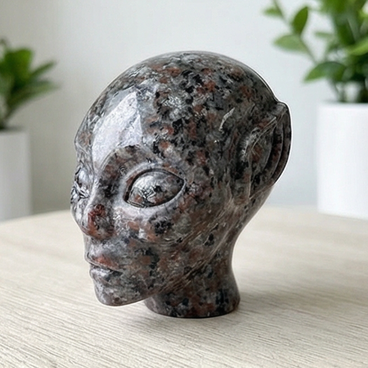 Additional view of a 2-inch Fire Stone alien skull carving