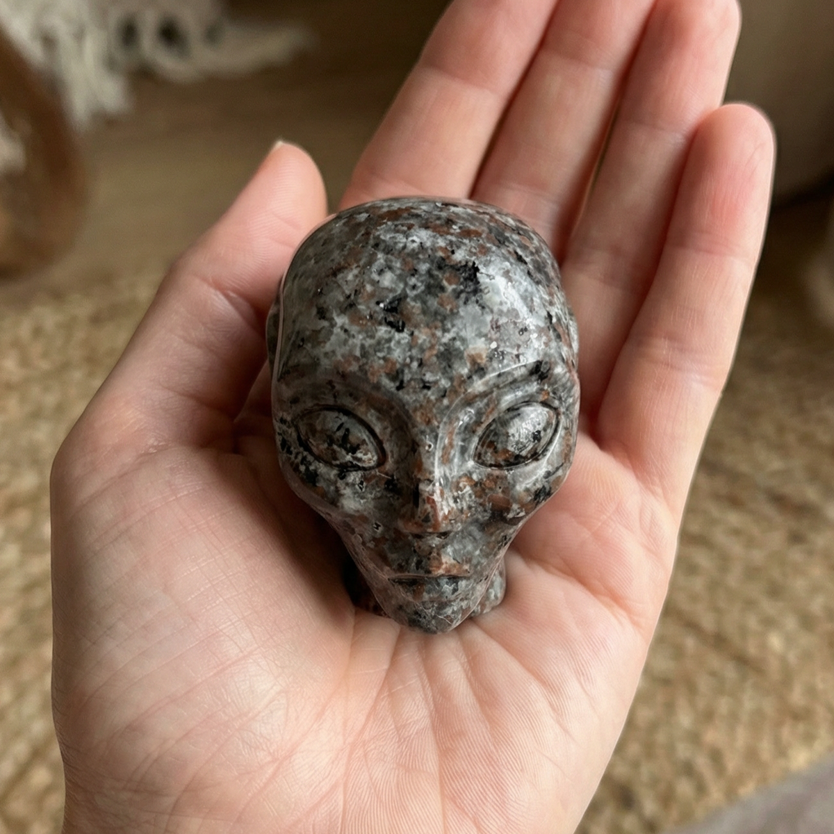 Additional view of a 2-inch Fire Stone alien skull carving
