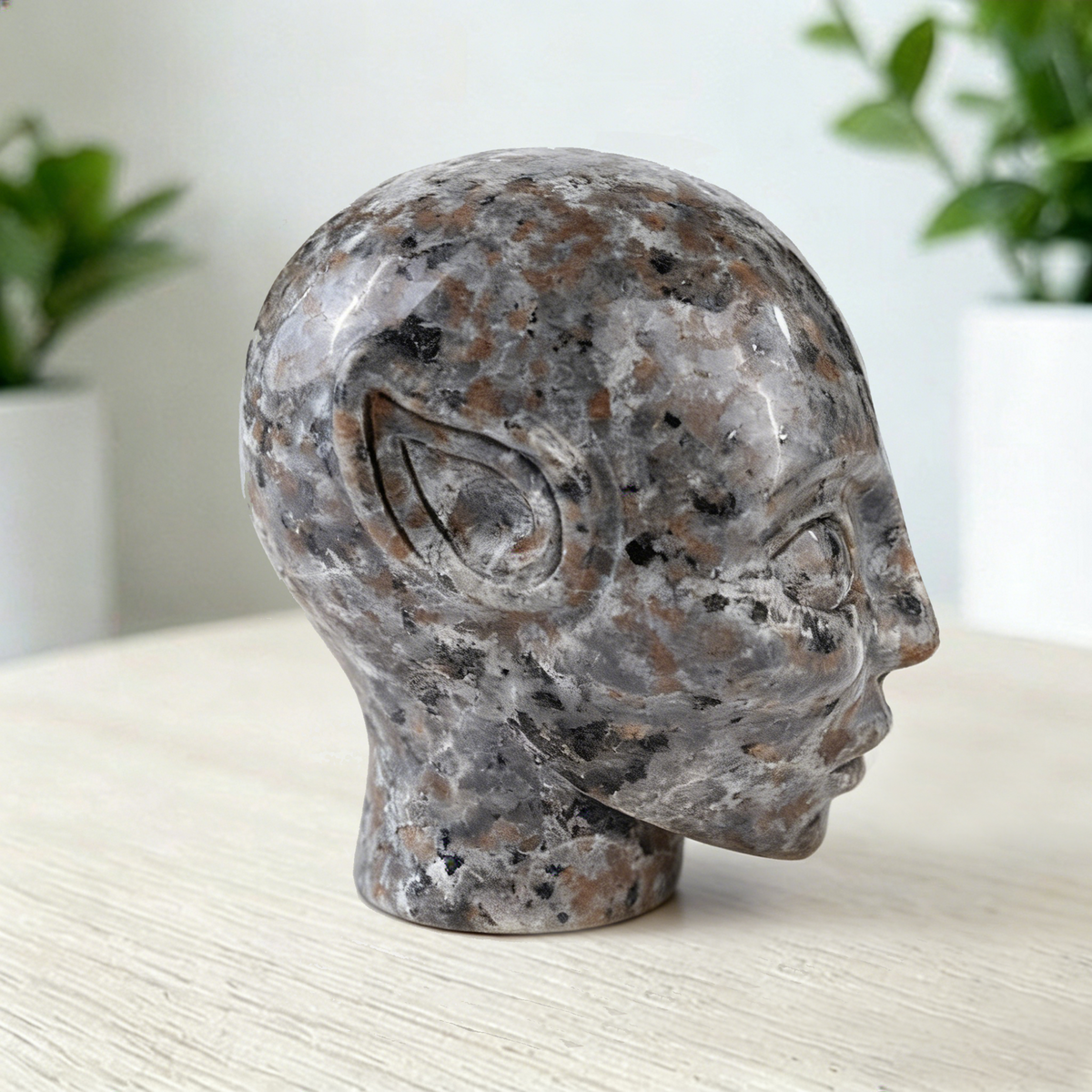 Additional view of a 3-inch Fire Stone alien skull carving